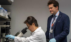 Antonio Giordano and Yueying Liu in a lab