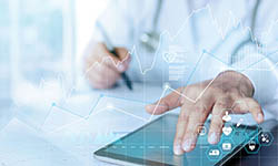 A collage showing a doctor using a tablet with line graphs and medical icons overlaid on top