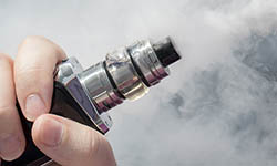 fingers holding e-cigarette